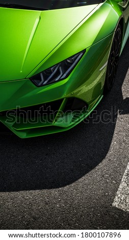 Green car supercar headlights sportcar Lambo Royalty-Free Stock Photo #1800107896
