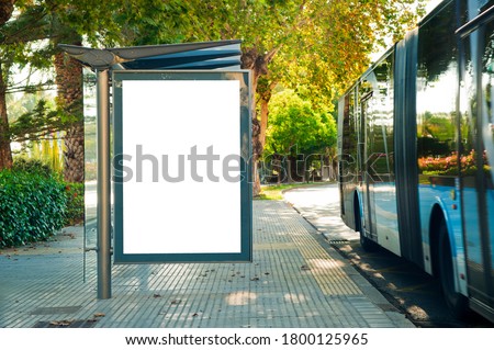 Blank electronic advertising poster with blank space screen for your text message or promotional content, clear banner in urban setting, empty poster at a bus stop, public information billboard