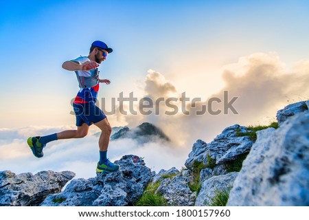 Man ultramarathon runner during a workout Royalty-Free Stock Photo #1800157960