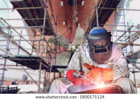 Welding process ship repair at floating dry dock in shipyard Royalty-Free Stock Photo #1800171124