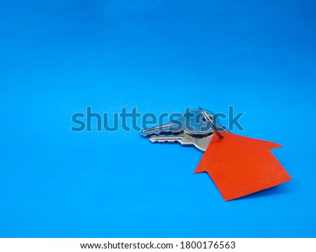 House Key with blue Background Stock Photos, Pictures & Royalty Free Images