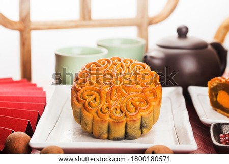 Mid-Autumn Festival concept, Traditional mooncakes on table  with teacup.