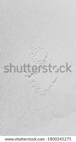 black and white picture handwriting font number TWO on nature sand beach