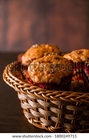 Appetizing homemade muffins on a wooden cutting board. Traditional festive Christmas baking.