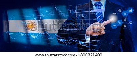 Businessman touching data analytics process system with KPI financial charts, dashboard of stock and marketing on virtual interface. With Argentina flag in background.