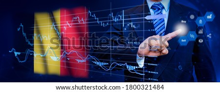 Businessman touching data analytics process system with KPI financial charts, dashboard of stock and marketing on virtual interface. With Belgium flag in background.