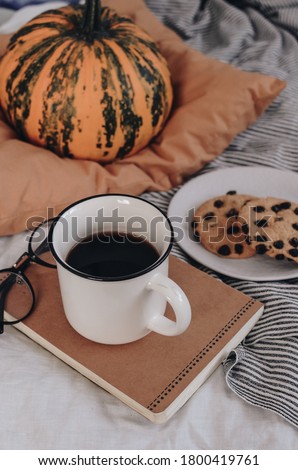 Morning concept. Breakfast in bed. Cozy autumn homely scene with pumpkins. Flat lay. Home decor. Morning before Halloween or Thanksgiving day.
