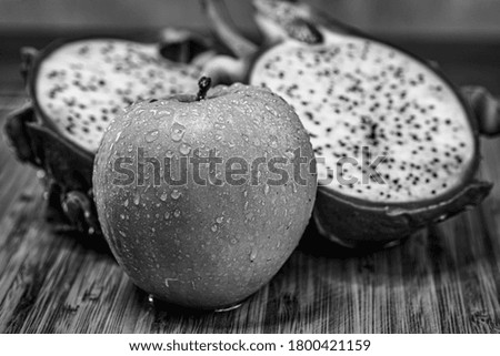 Mixed fruits on wooden plate close-up