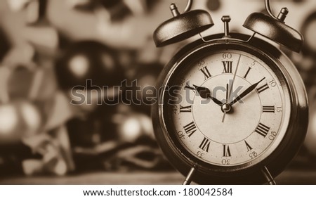 Vintage clock on christmas background. Photo in retro color image style.