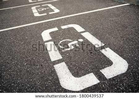 Parking lot markings for disabled people
