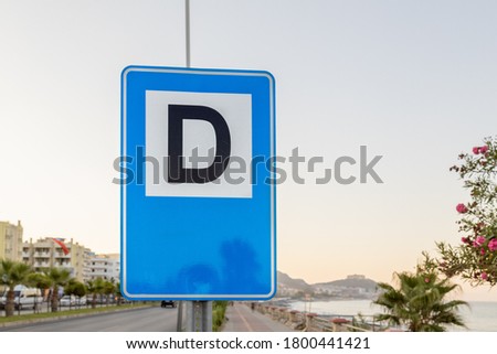 Turkish Durak sign means Bus stop on the shore of the sea highway