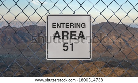 Entering Area 51 Sign On A Fence At The Military Base In The Nevada Desert At Sunset Royalty-Free Stock Photo #1800514738