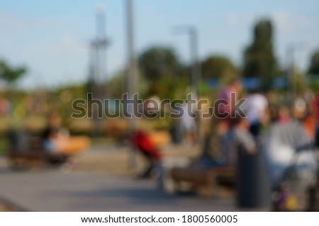 Blurred background. People in the Park.
