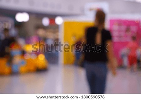 Blurred background. Shopping center gallery with people.