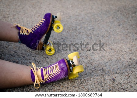 Purple Roller Skates with Yellow Wheels