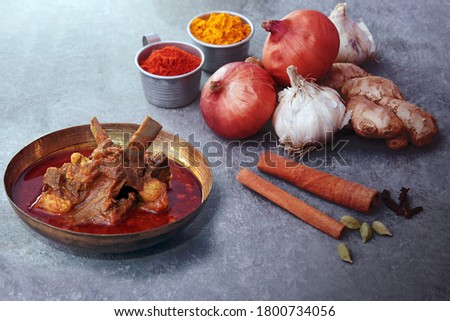 Bengali mutton curry aka Mangshor Jhol is a classical comforting curry prepared with mutton with limited spices. Royalty-Free Stock Photo #1800734056