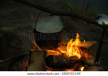  camping cauldron. cauldron at the stake. rest by the river. High quality photo