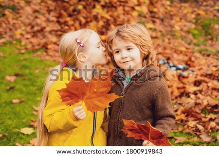 Romantic children at a park. Autumn style
