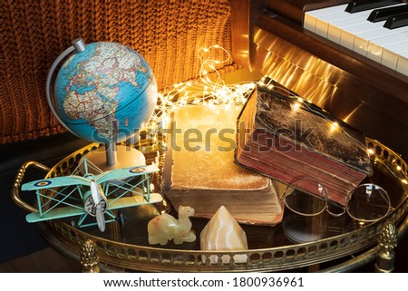 Globe and books on a coffee table.