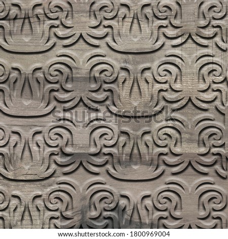 carved  geometric design on wooden background