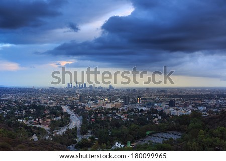 Los Angeles city skyline cityscape with beautiful storm clouds sky background.