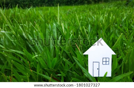 Small Paper House On Green Nature Stock Photo