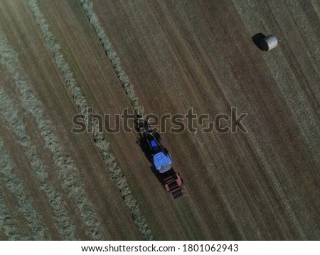 
Aerial shots of Hay harvesting with tractor. Near the town of Castelgomberto, in the province of Vicenza. Northern Italy.