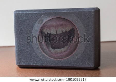 Open mouth yelling inside the speaker. Communication concept.