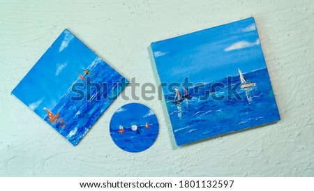 Nice sea side acrylic painting on canvas and CD isolated with white textured background 