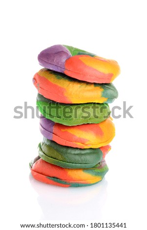 closeup stack of rainbow bagels