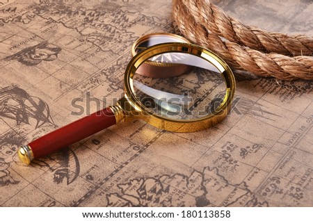 ancient map and magnifying glass
