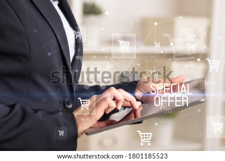 Young person makes a purchase through online shopping application with SPECIAL OFFER inscription