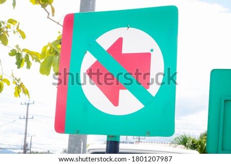 The sign with a red arrow is expected to be green.