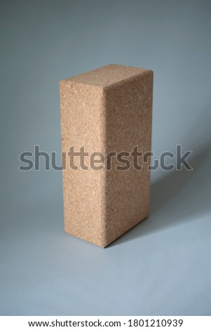 Yoga blocks made of cork on a gray background
