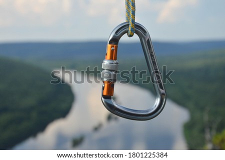 aluminum carbine hanging over the abyss Royalty-Free Stock Photo #1801225384