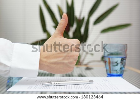  thumbs up gesture over signed application