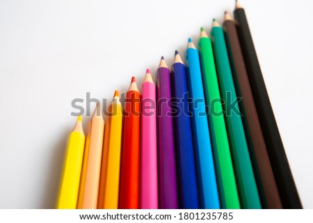 wooden colored pencils on white background