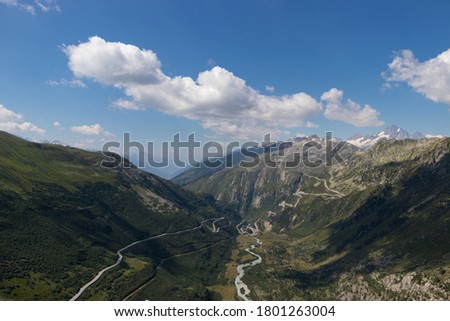 Beautiful picture of majestic swiss mountains with twisty roads
