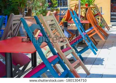 Cafe multicolored chairs. Greece, Corfu