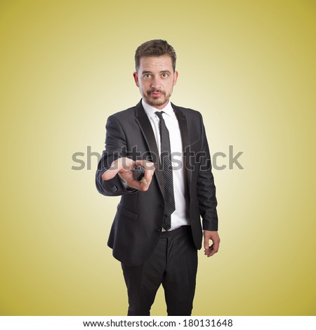 Business man offering a car key over orange gradient background
