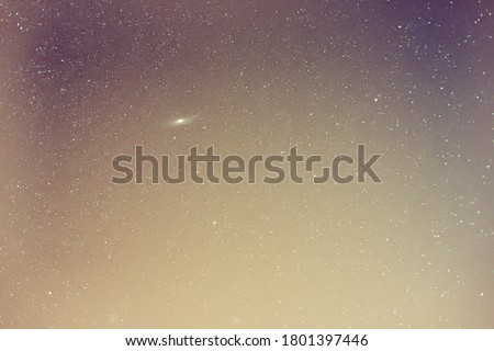 Universe and Andromeda Galaxy in the night sky.