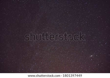 Universe and Andromeda Galaxy in the night sky.