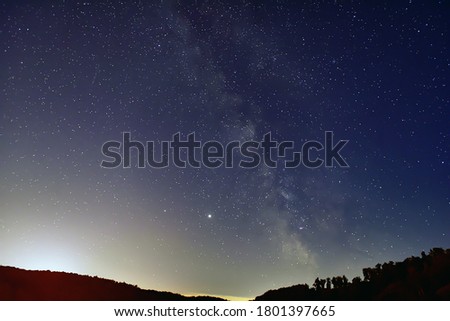 Milky Way, Saturn and Jupiter  in the night sky.