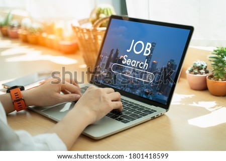 Back view of woman browsing work opportunities online using job search computer app after being laid off during covid-19 or coronavirus outbreak at home.find your career and recruitment concept. Royalty-Free Stock Photo #1801418599