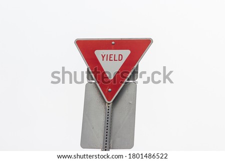 Red and white Yield sign  with sky.
Drive safely. Warning accident prevention. Traffic signal.