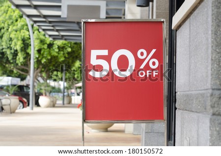 Red sale sign outside store