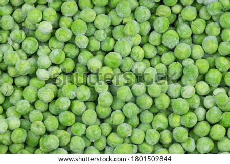 Frozen green peas texture background. ice peas background for food textures. Raw vegetables.