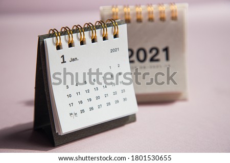Happy new year 2021. Close up calendar on a pink desktop Royalty-Free Stock Photo #1801530655
