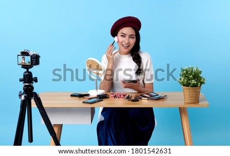 Asian young woman live streaming for beauty vlogger or blogger recording make up tutorial presenting for social people.Her is influencer in social online. Royalty-Free Stock Photo #1801542631