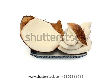 Sliced of Coconut in plate Isolated on white background